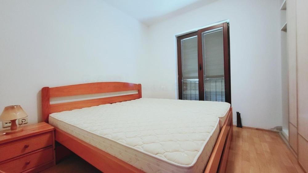Bedroom with double bed and balcony door