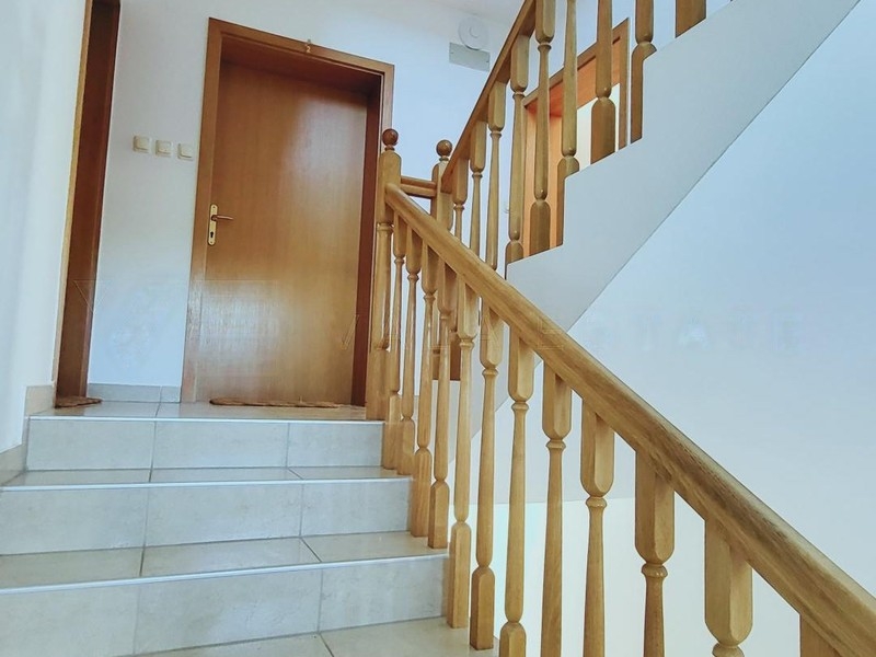 Stairwell with wooden banister