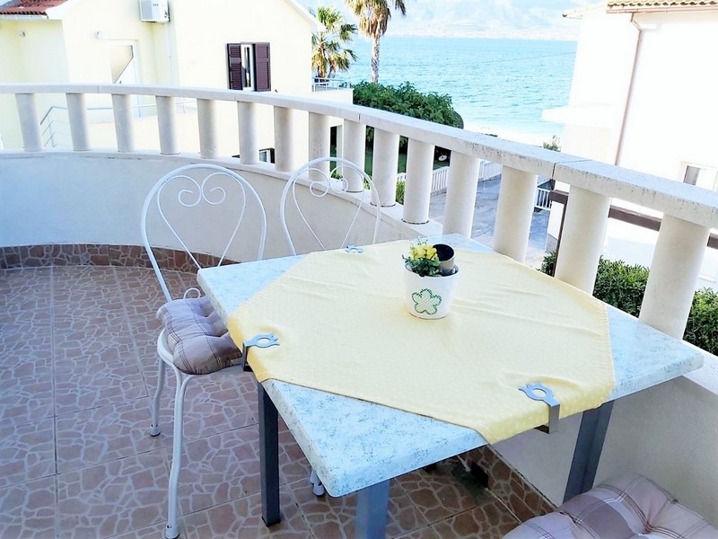 Balcony of an apartment building with sea view, house close to the sea