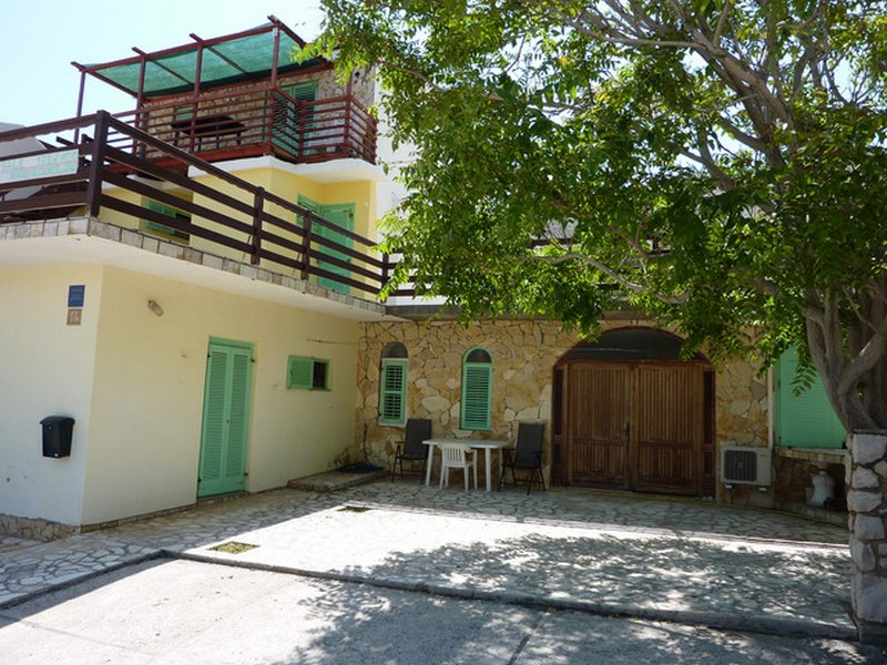 Front view of house H3419 near the sea on the island of Pag in Croatia.