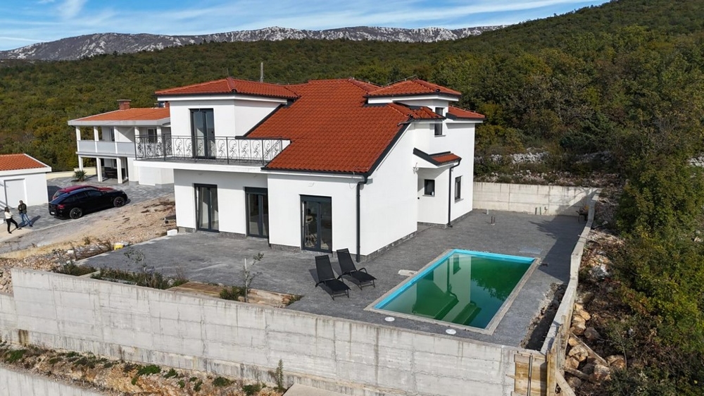 New building with pool and sea views for sale near Crikvenica, Croatia.