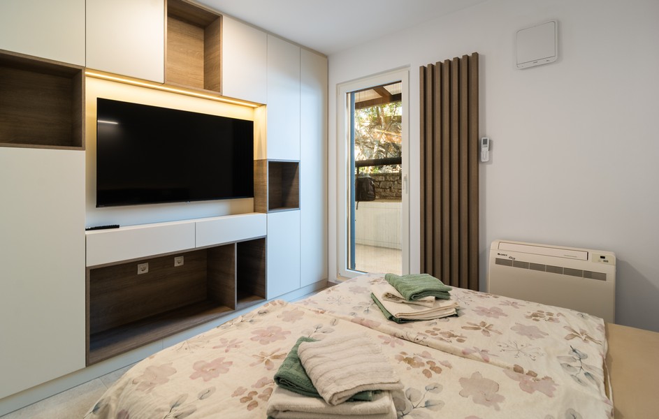 Guest room with double bed and built -in cabinet