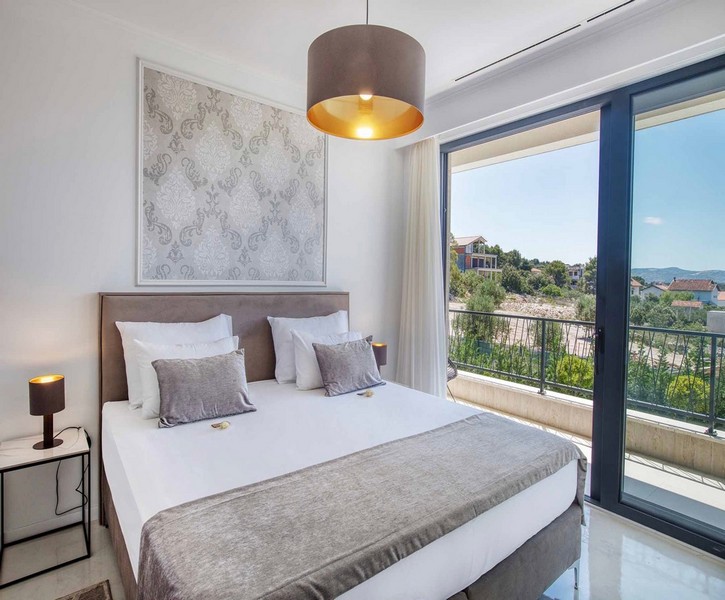 Bedroom with double bed and balcony access