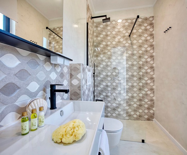 Modern bathroom with shower and stylish tiles