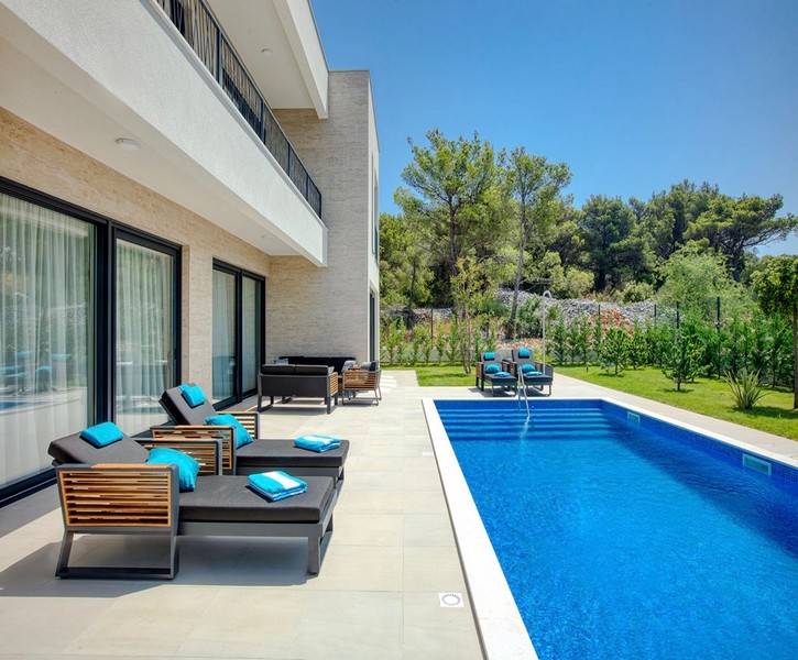 Pool terrace with sun loungers and modern design