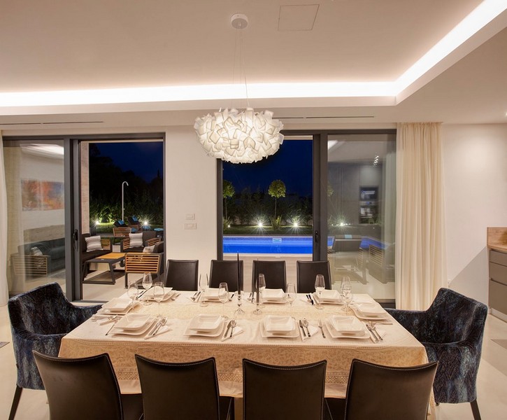 Dining area overlooking the pool at night