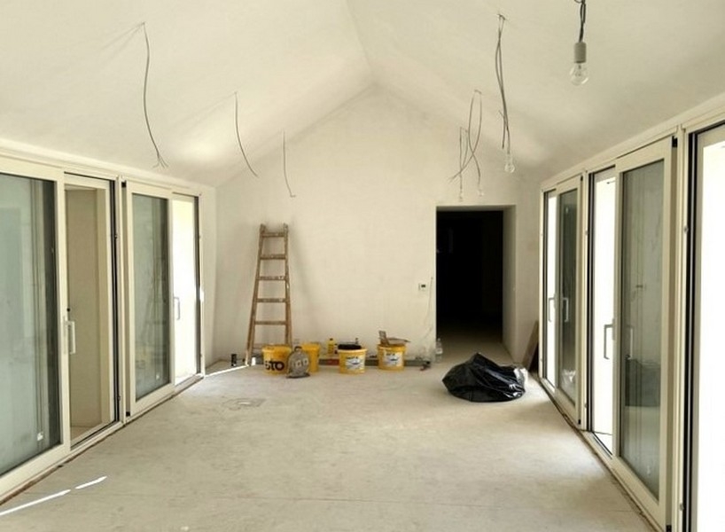 Interior of house under construction with sliding doors