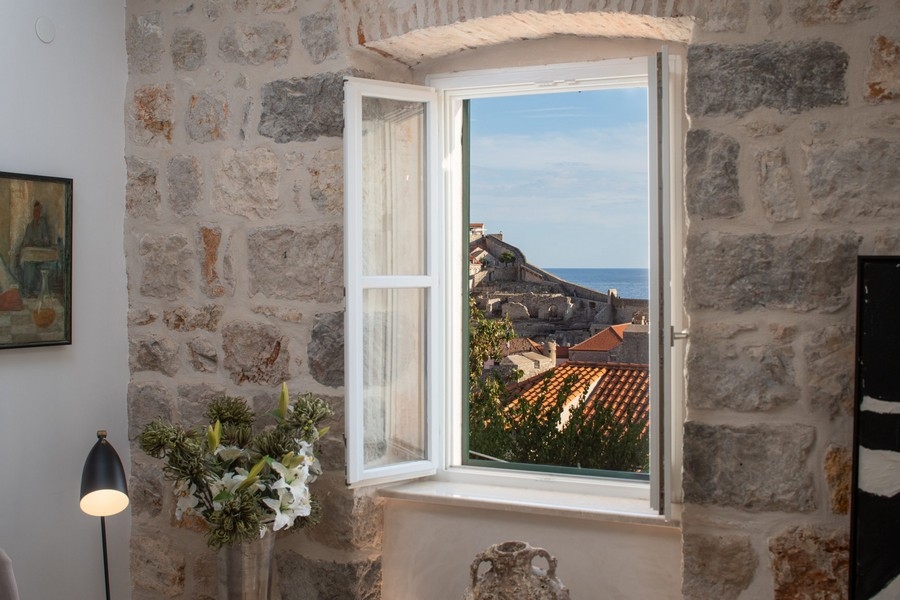 Window view of Dubrovnik old town and sea