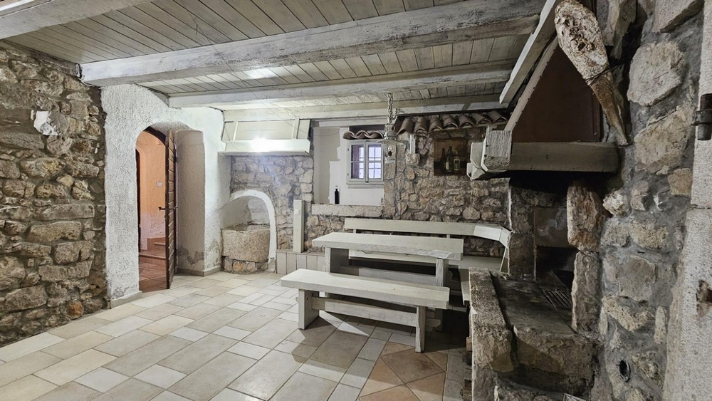 Traditional stone cellar with seating area