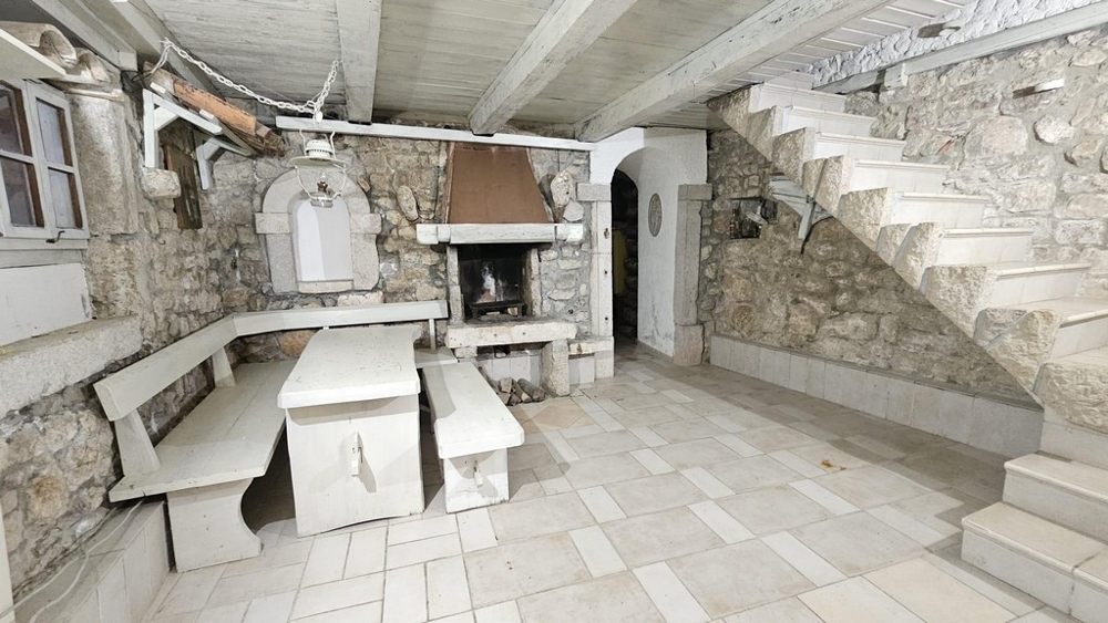 Fireplace room with stone stairs