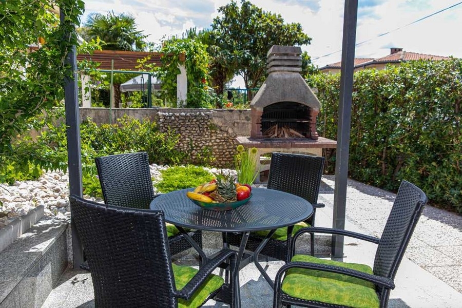Garden area with seating area and brick barbecue