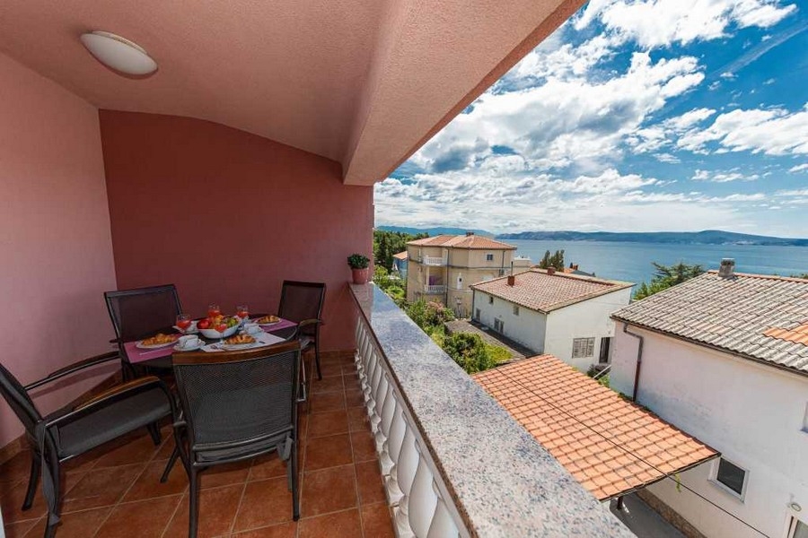 Covered balcony area with sea views