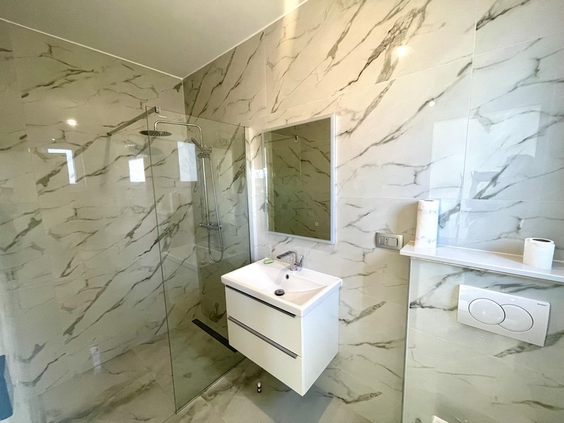 Modern bathroom with shower and vanity