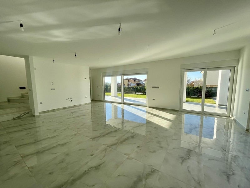 Bright living area with floor-to-ceiling windows