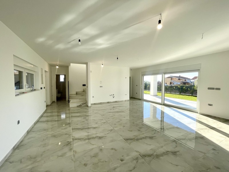 Living area with stairs and terrace access