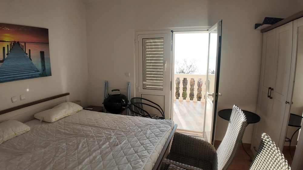 Bedroom with balcony access