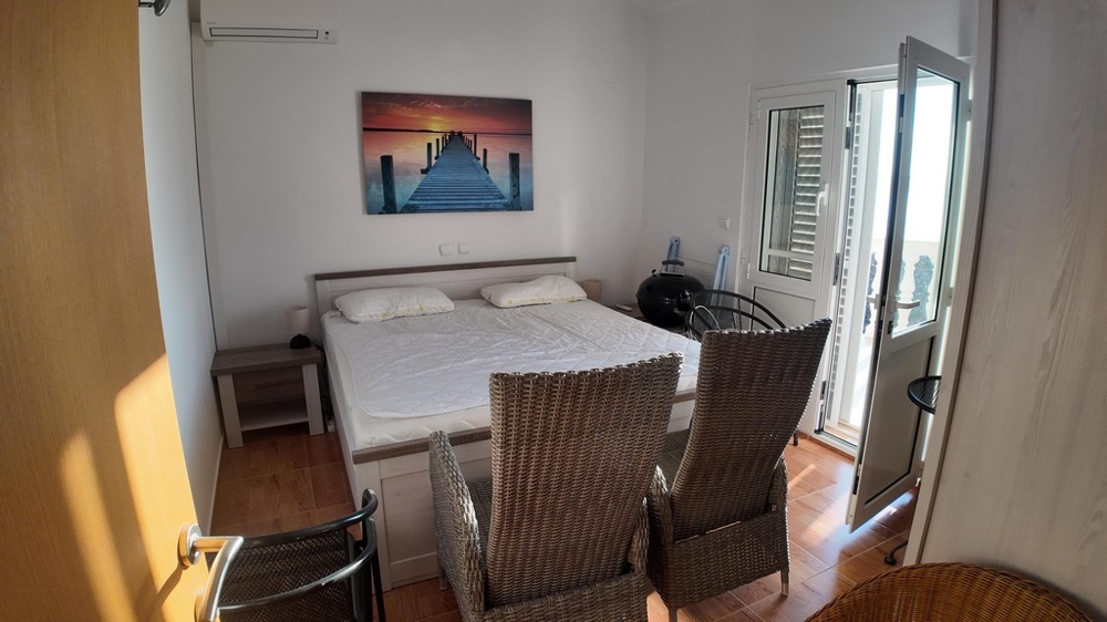 Bedroom with balcony on the upper floor.