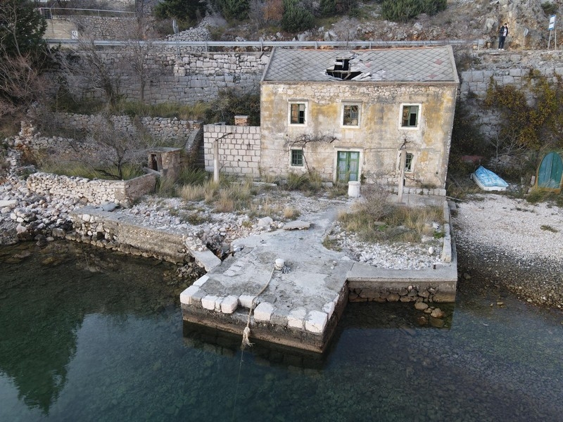 Stone house on the water with panoramic sea views and natural stone facade