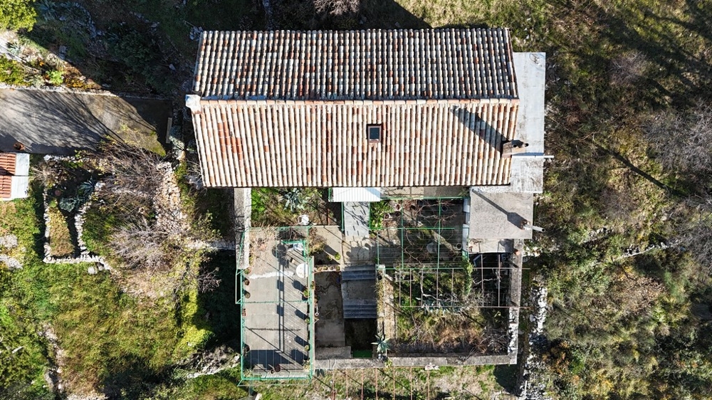 Top view of house with terrace and adjacent property
