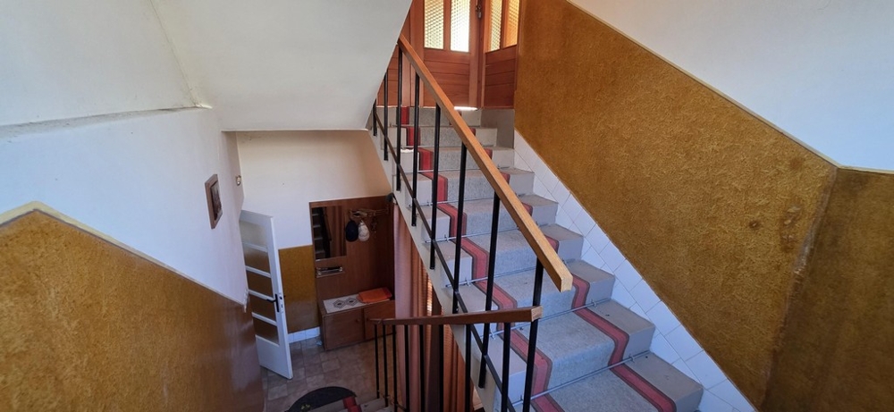 Bedroom with wardrobe and balcony access