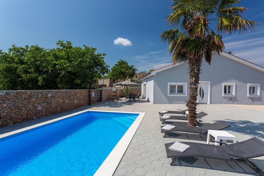Pool area with sun loungers