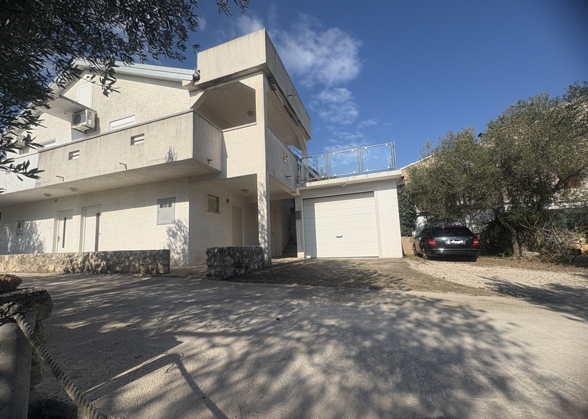 View over residential area with sea in the background