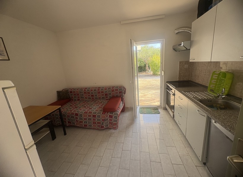 Kitchen-living room with seating area and exit