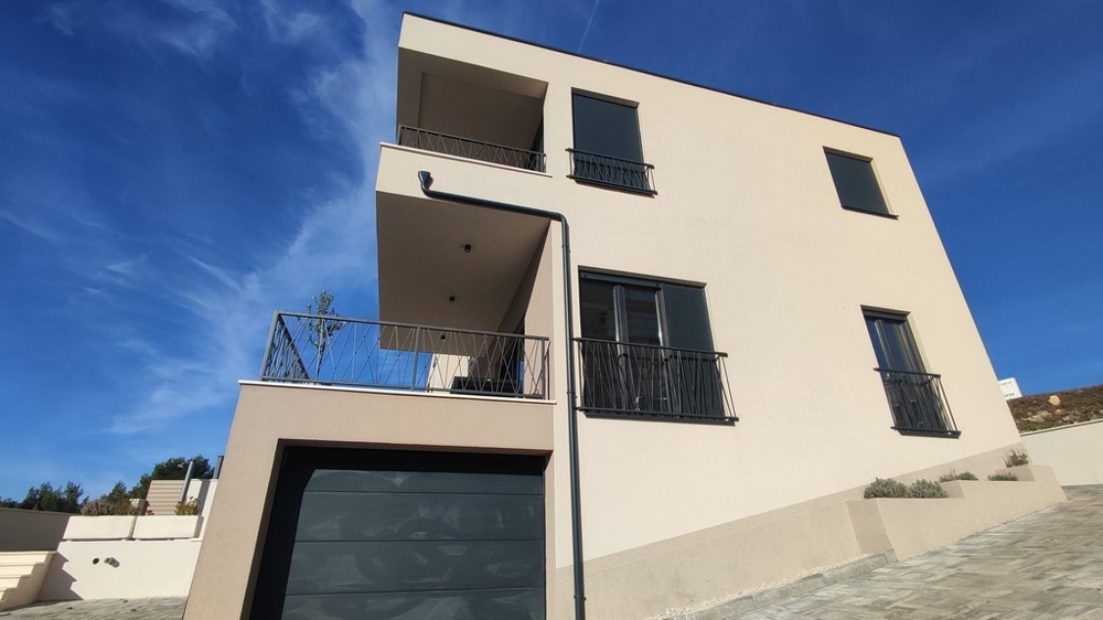 Modern house facade with balconies in a quiet location