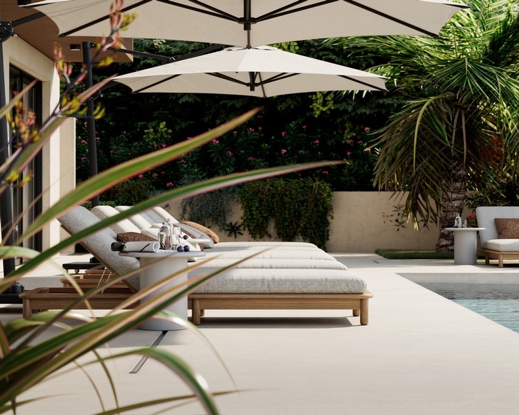 Sun loungers by the pool with garden views