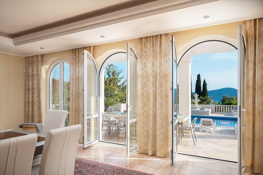 Living area with large windows and pool views
