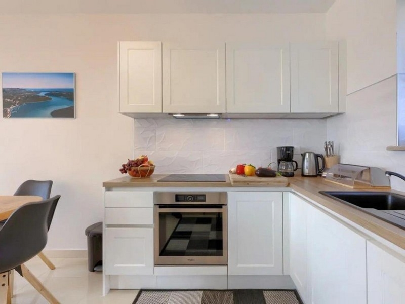 Modern fitted kitchen with electrical appliances