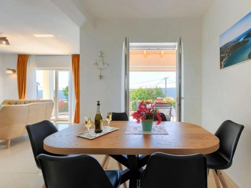 Dining area with a view of the terrace and sea