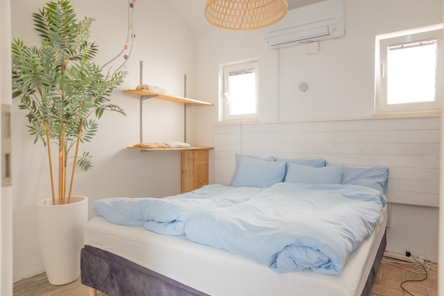 Bedroom with double bed and air conditioning