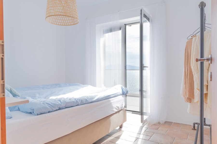 Bright bedroom with open sea views