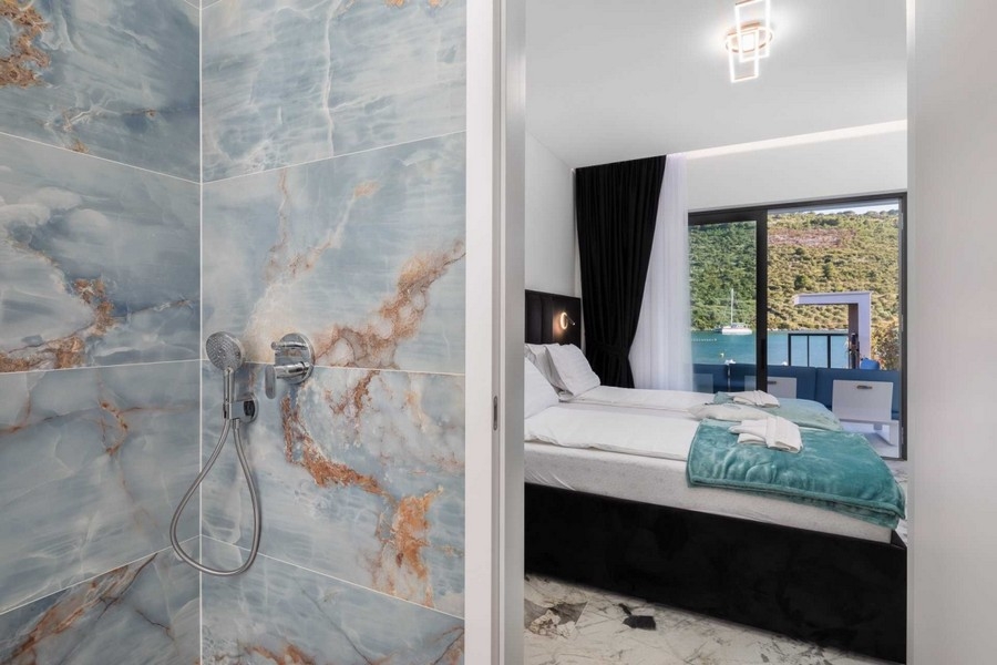 Bathroom with large format tiles and shower