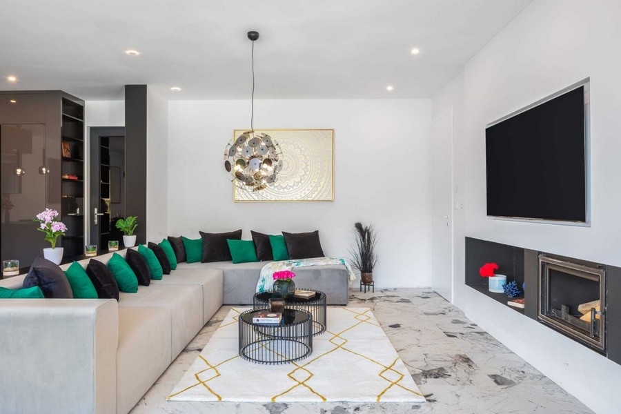 Living room with fireplace and large sofa