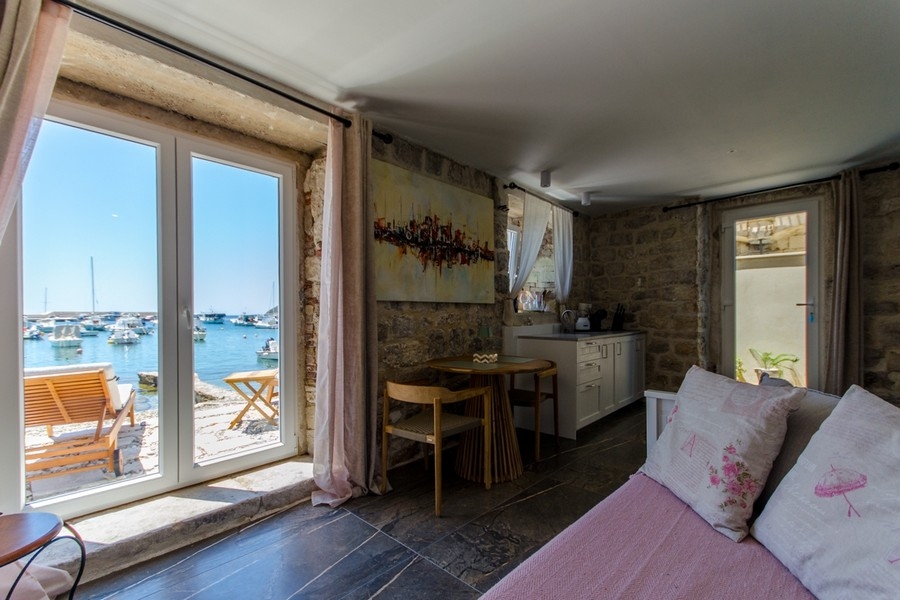 Living room with views of the harbor and sea
