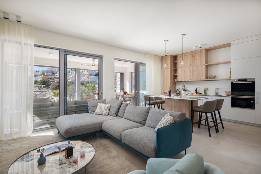 Open living area with kitchen and large window front