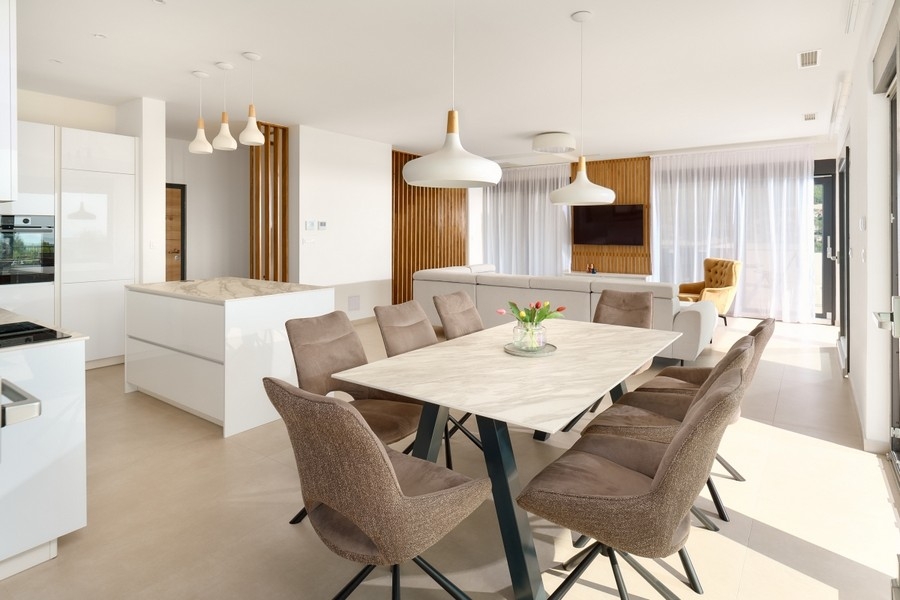 Living room with modern seating area and view of the landscape