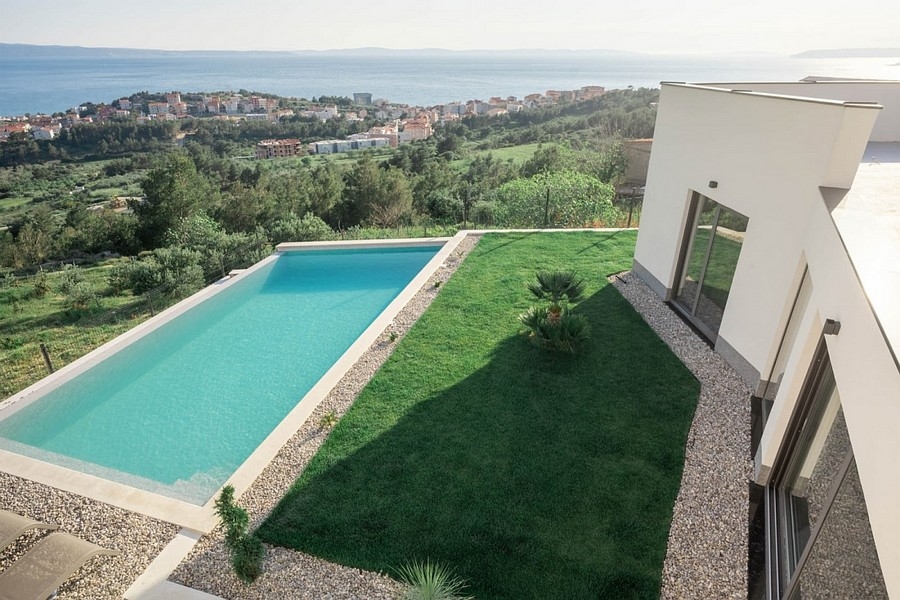 View of the pool and the sea from the villa H3816 near Split in Croatia.