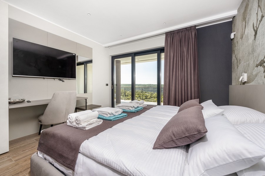 Bedroom with access to the terrace and distant views