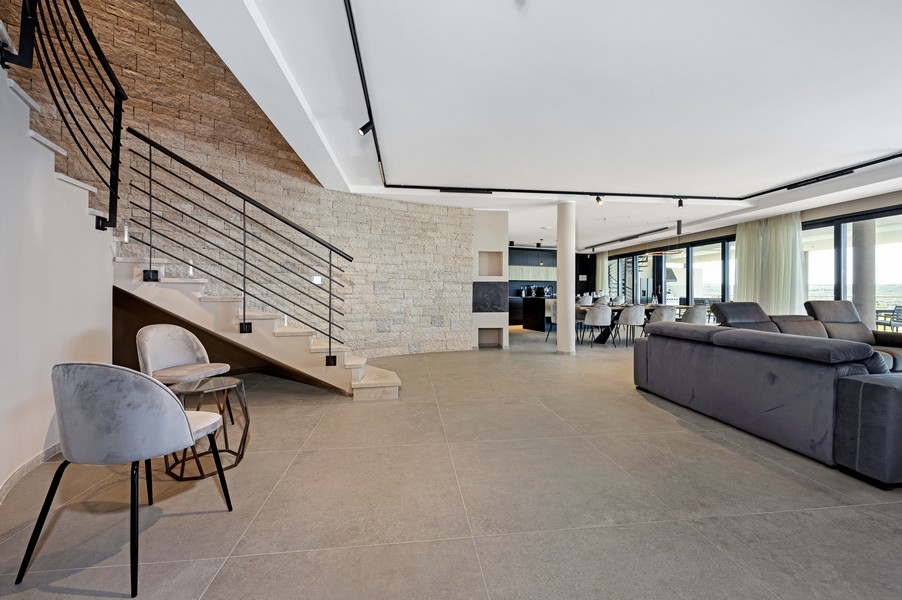 Open living area with stairs and high-quality furnishings