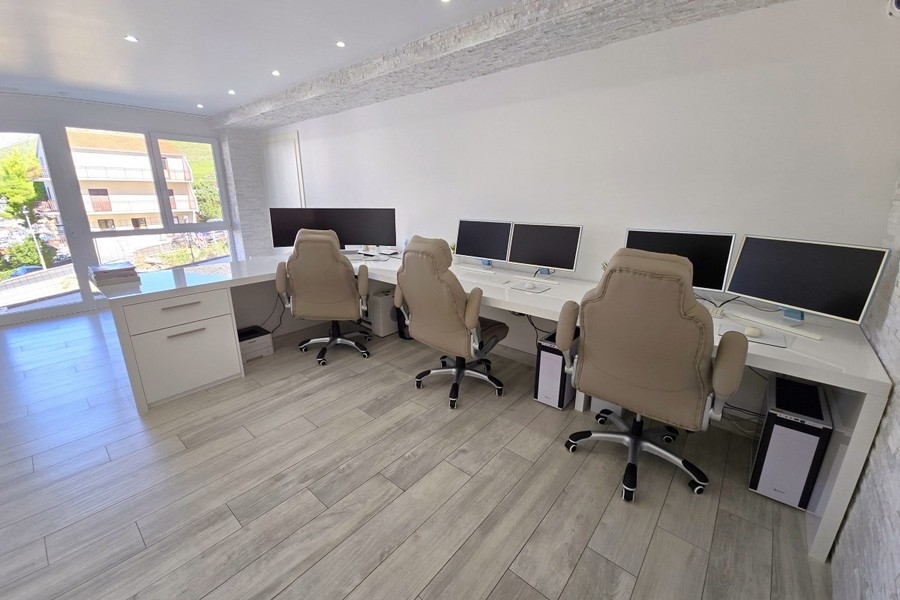 Office with several workstations and a large window