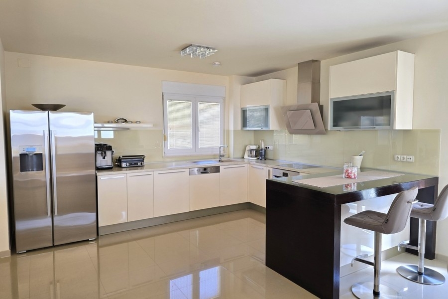 Modern kitchen with cooking island and high-quality appliances