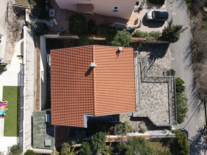 Aerial view of the house with property and terraces