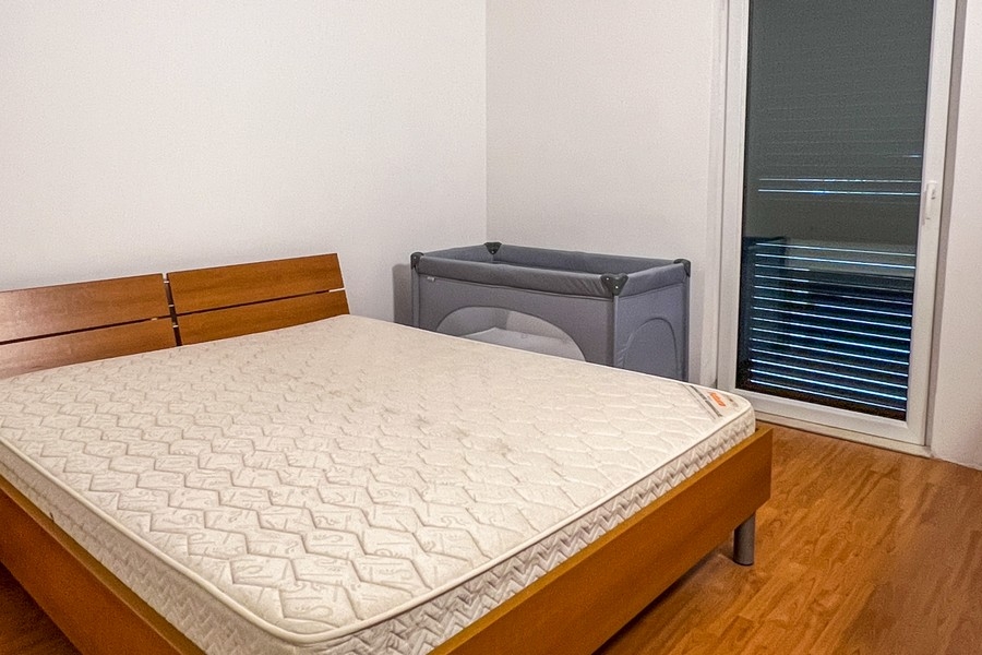 Bedroom with double bed and balcony access