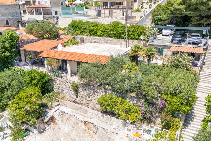 Aerial view of the house with garden and terraces