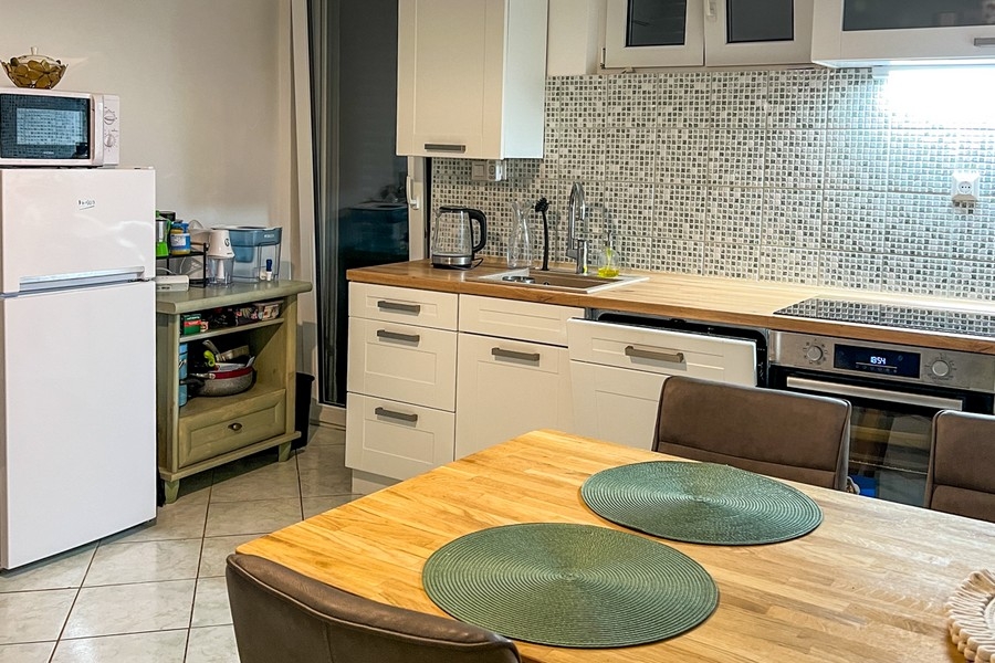Kitchen with work surface and dining area