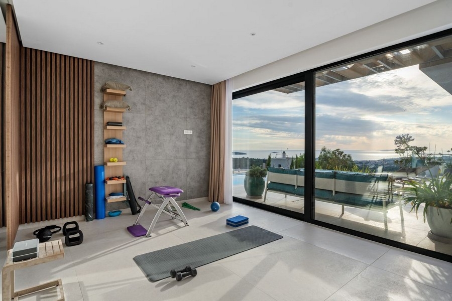 Fitness room with large windows and sea views