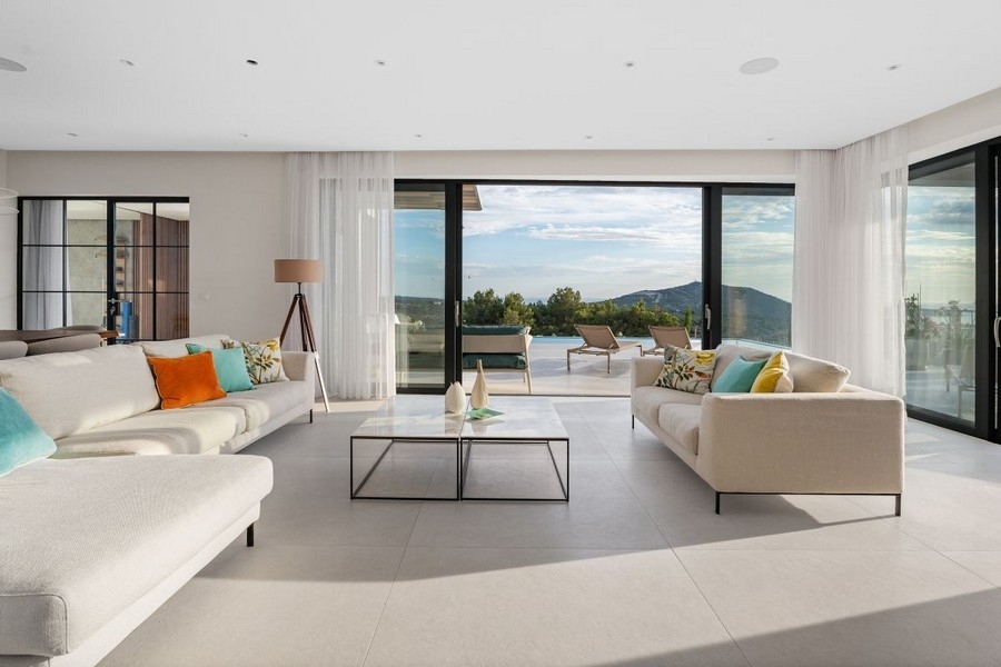 Spacious living area with panoramic windows and sea views